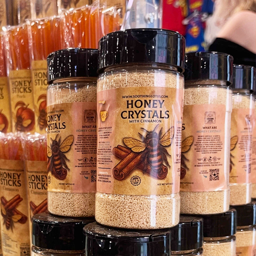 Jars of honey crystals with cinnamon on a store shelf.